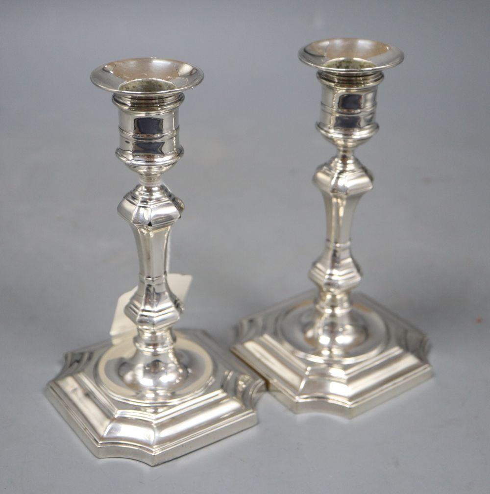 A pair of Edwardian 18th century style silver candlesticks, Gibson & Co Ltd, Sheffield, 1909, weighted, 15.2cm.